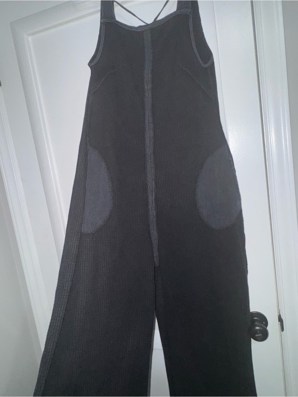 So Me Black Wide-Leg Knit Jumpsuit with Round Patch Pockets